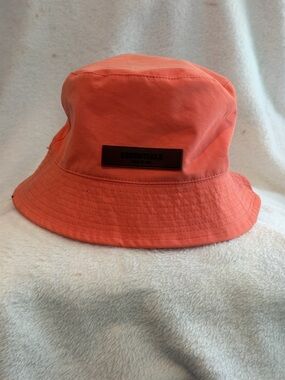 Fear of God essentials coral bucket hat size S/M excellent condition!